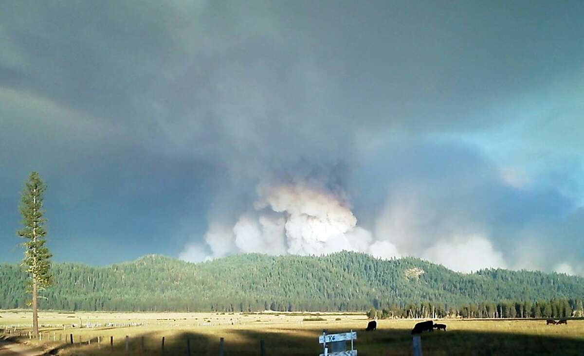This image provided by Inci Web shows a plume of smoke Saturday Aug. 18, 2012 at the Chips Fire inside the Plumas National Forest in northern california. This fire has burned through 67 square miles and is 20 percent contained.(AP Photo/ InciWeb)