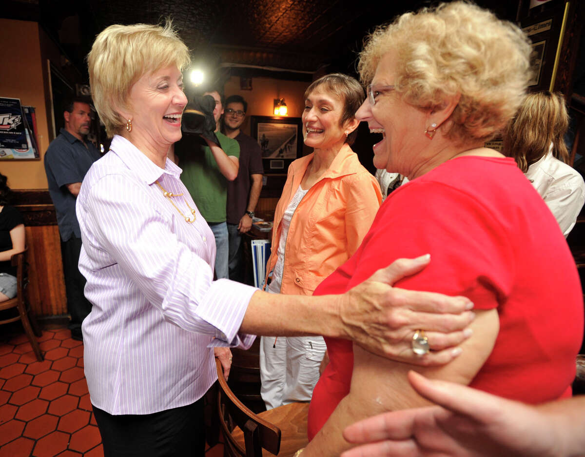Linda McMahon, Republican candidate for the U.S. Senate, greets Pauline Basso, who works out of McMahon's Danbury office, at T.K.'s American Cafe durng McMahon's trip through Danbury on Wednesday, Aug. 15, 2012 the day after she won the Republican Primary.
