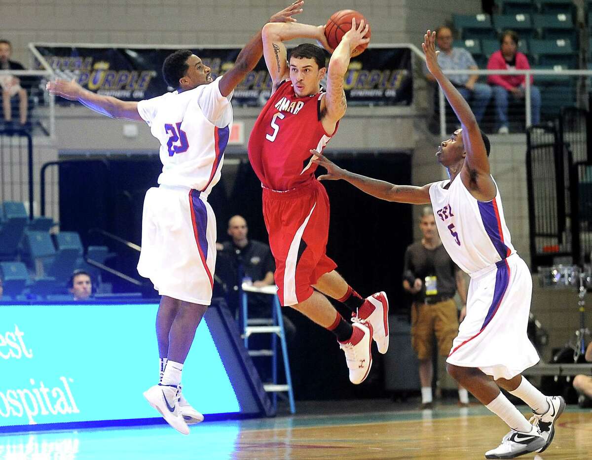 Lamar's Mike James looks to pass while under pressure from SFA's Desmond Haymon and Antonio Bostic at the Merrell Center in Katy, Thursday, March 8, 2012. Tammy McKinley/The Enterprise