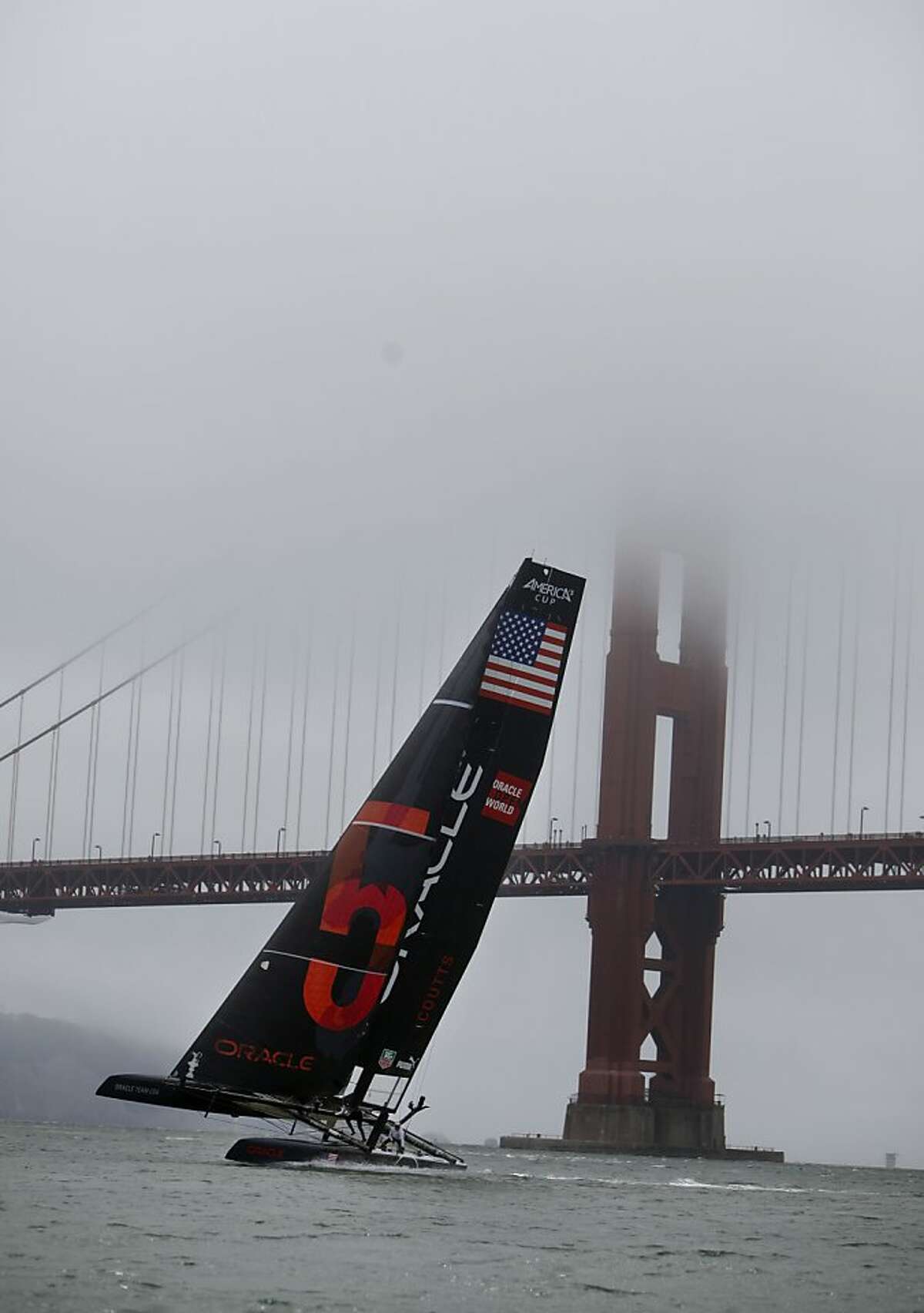 Team Oracle USA Coutts sails next to the Golden Gate Bridge before the start of the Match Racing Qualifiers for the America's Cup World Series on Wednesday, August 22, 2012 in San Francisco, Calif. Team Oracle USA Coutts did not race on Wednesday.