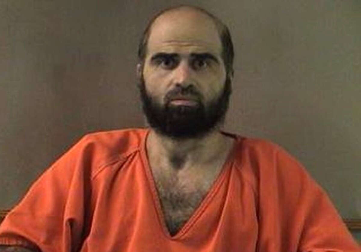 FILE - This undated file photo provided by the Bell County Sheriff's Department via The Temple Daily Telegram shows Nidal Hasan, the Army psychiatrist charged in the deadly 2009 Fort Hood shooting. In a document filed on behalf of Col. Gregory Gross, attorneys contend that forcibly shaving Hasan would not violate the American-born Muslim's religious freedoms. The U.S. Court of Appeals for the Armed Forces delayed the start Hasan's court-martial to consider the question of whether he should be forcibly shaved. (AP Photo/Bell County Sheriff's Department via The Temple Daily Telegram, File)