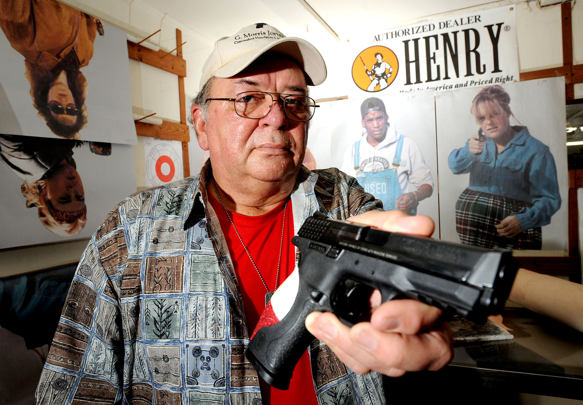 Man who opened fire to defend himself stands with many on gun control