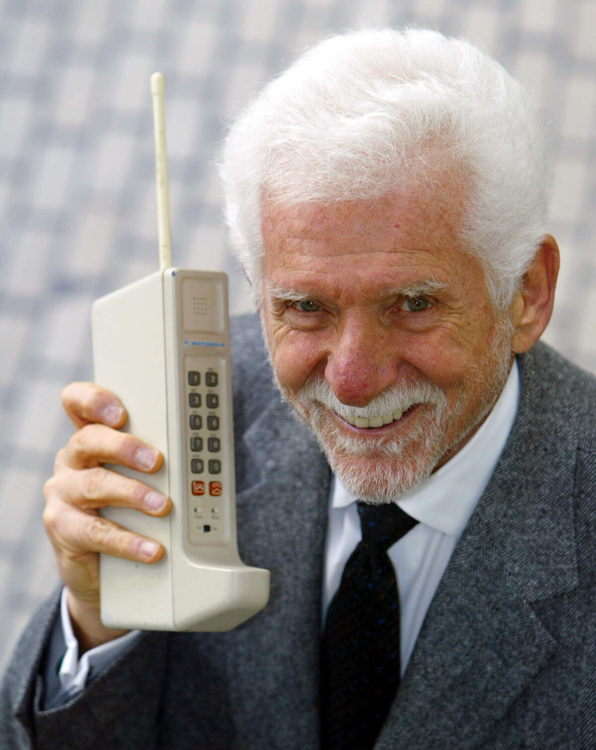 History of the cell phone Martin Cooper, chairman and CEO of ArrayComm, holds a Motorola DynaTAC, a 1973 prototype of the first handheld cellular telephone in San Francisco, Wednesday April 2, 2003. (AP)