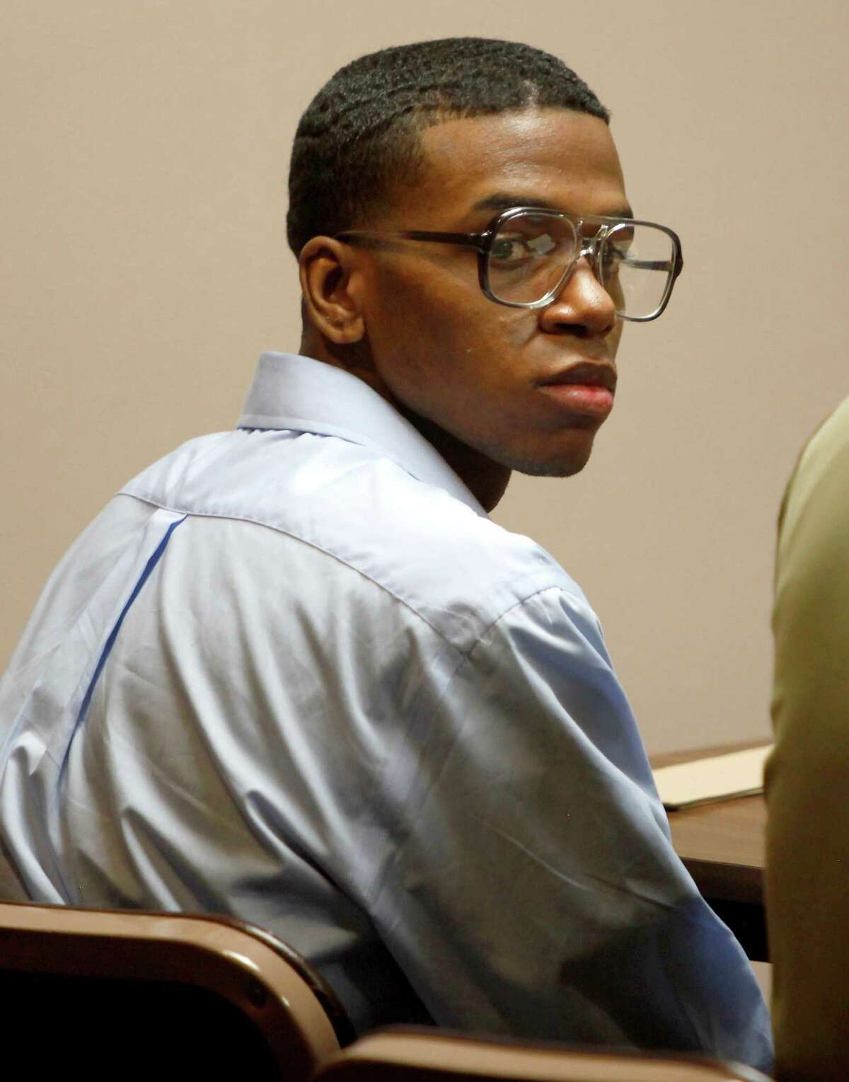 Lorenzo Leroy Thompson, 23, looks Thursday afternoon Aug. 23, 2012 around Judge Melisa (cq) Skinner's 290th State District Court after being found guilty of capital murder in the death of Air Force recruit Vanessa Marie Pitts, 25.