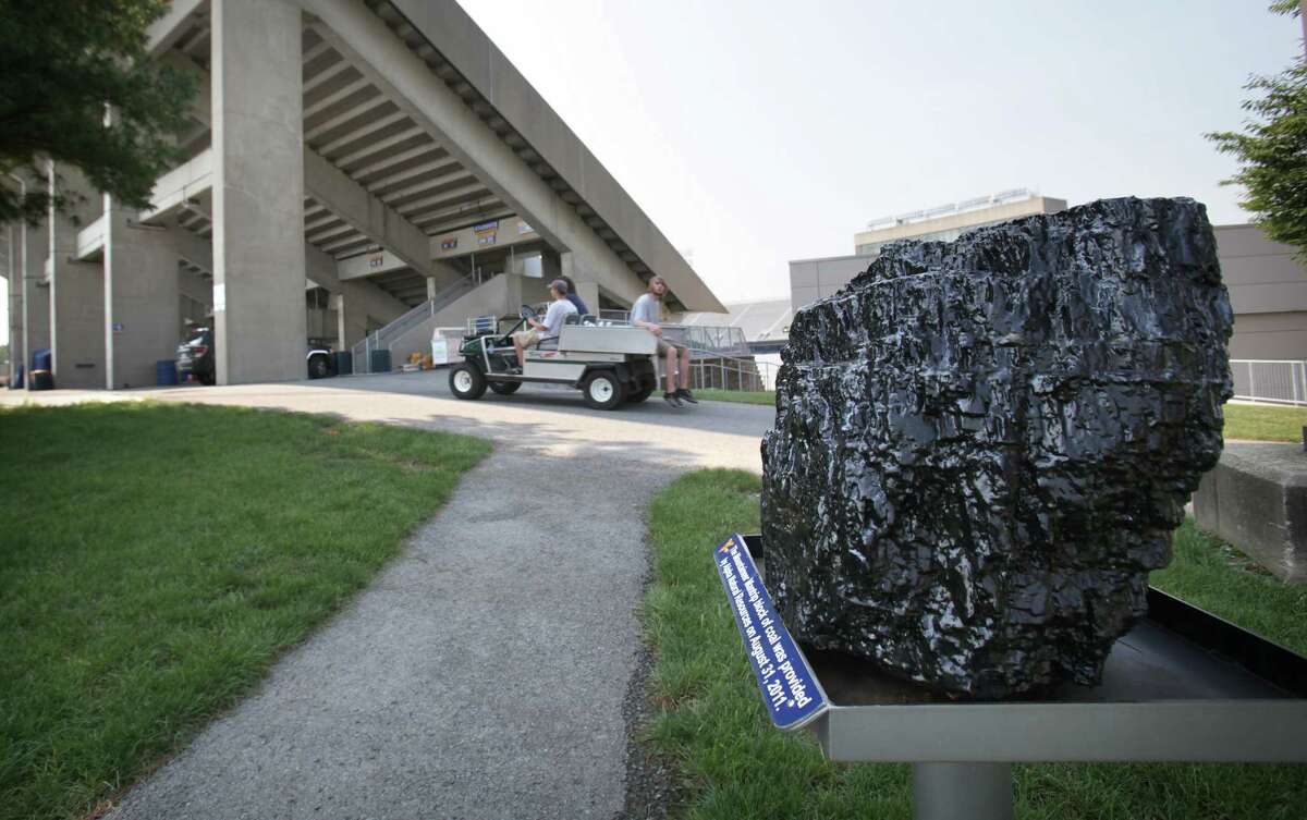 The chunk of coal on the "Mountaineer Mantrip" that players touch as they enter West Virginia University Milan Puskar Stadium, in Morgantown, West Virginia. Thursday, Aug. 9, 2012.