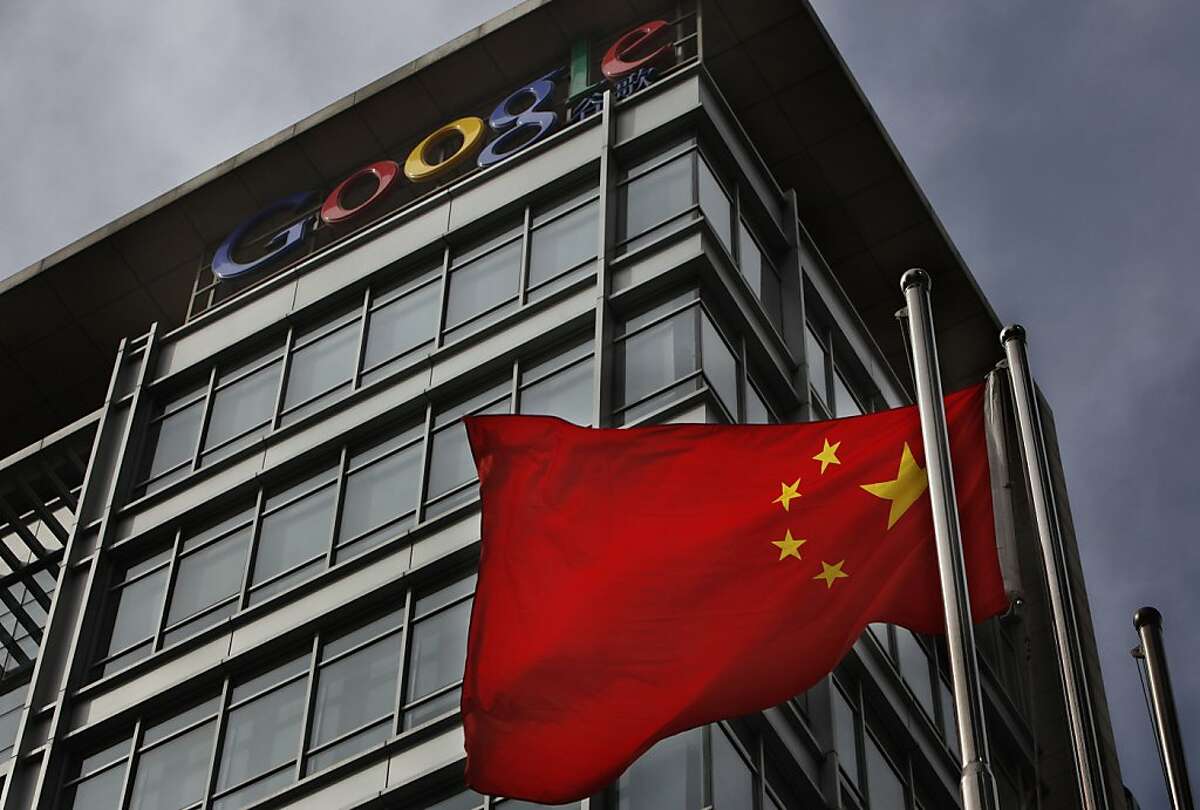 FILE - In this March 25, 2010 file photo, a Chinese flag flaps in the wind in front of the Google China headquarters in Beijing. Google is hiring dozens of marketing and technical employees in China to defend a shrinking market share against local rivalsafter closing its Chinese search engine six months ago this Wednesday, Sept. 22 in a dispute over censorship.