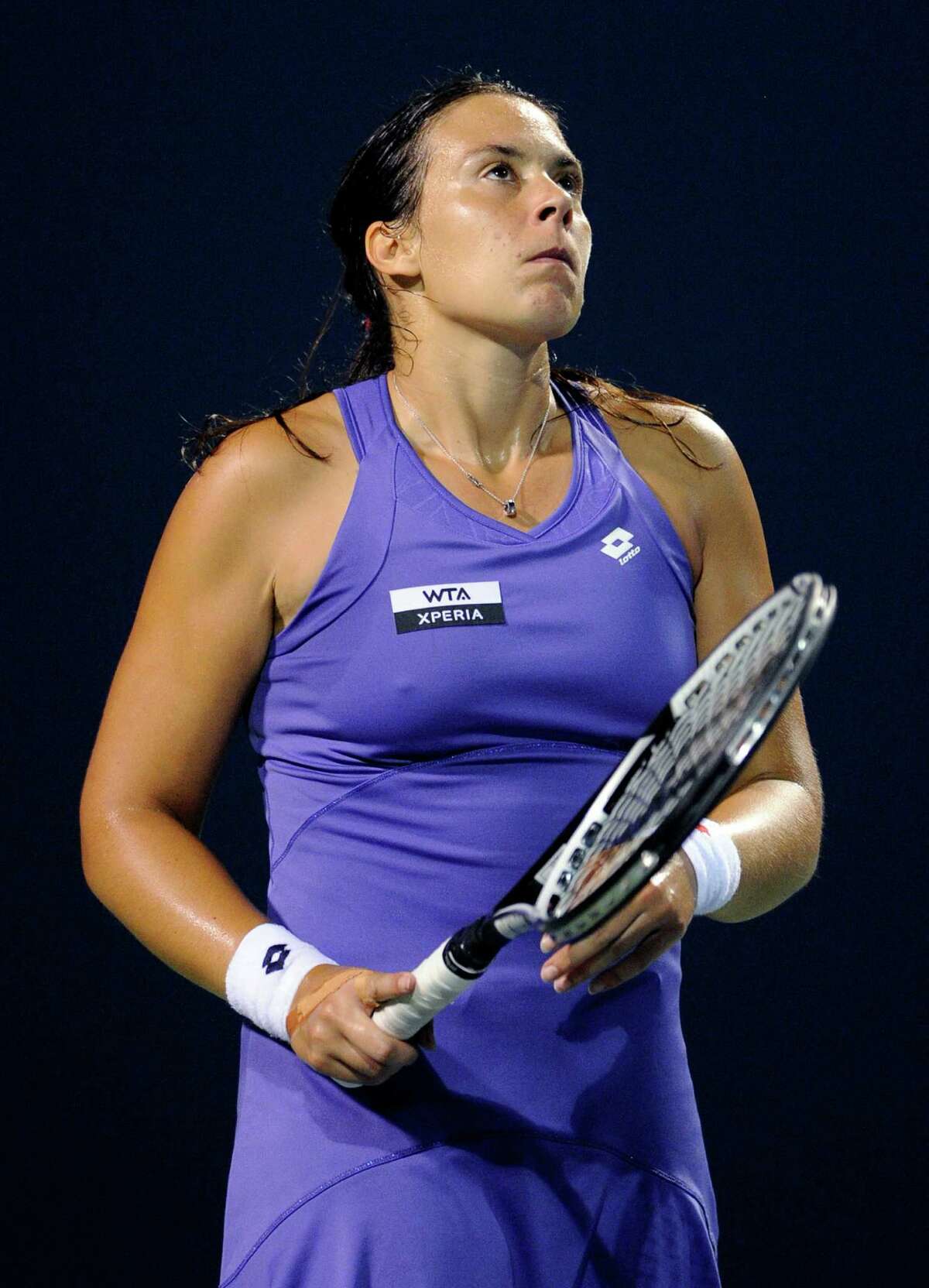 Marion Bartoli, of France, reacts after losing a point in her 6-4, 6-3 loss to Sara Errani, of Italy, during a quarterfinal at the New Haven Open tennis tournament in New Haven, Conn., on Thursday, Aug. 23, 2012. (AP Photo/Fred Beckham)