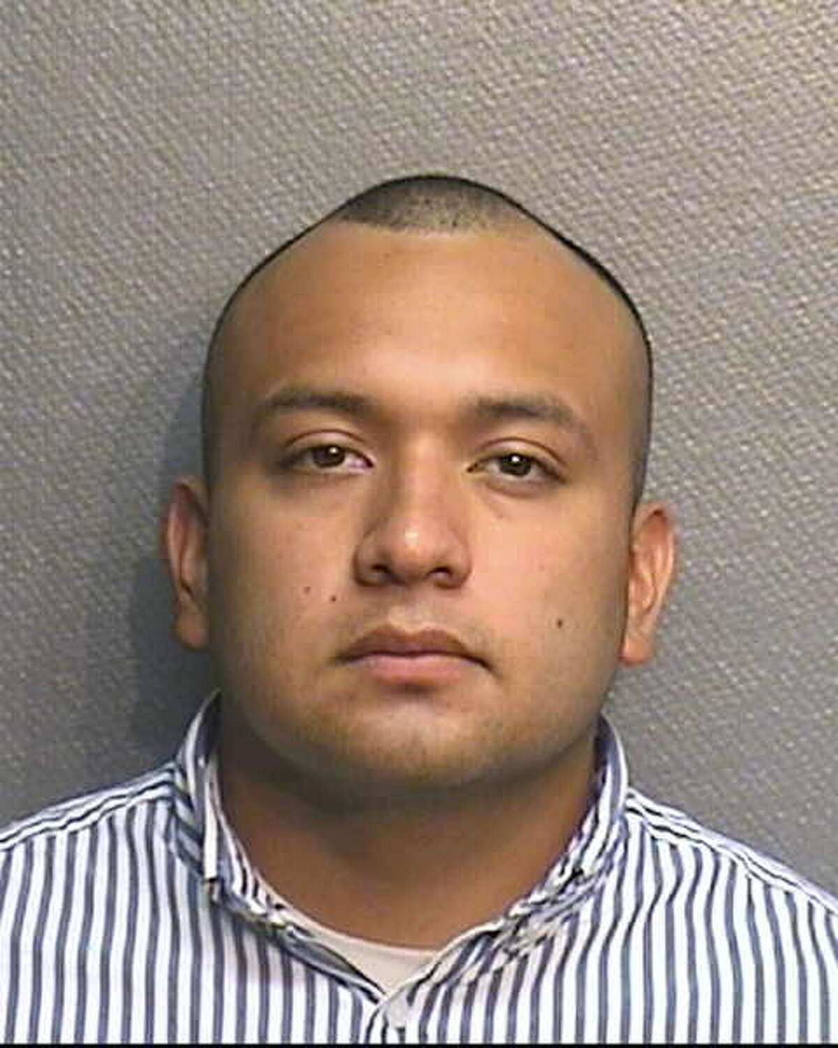 Ray Faustino Acuna, a former Houston police officer, is accused of robbing the office where his wife worked.