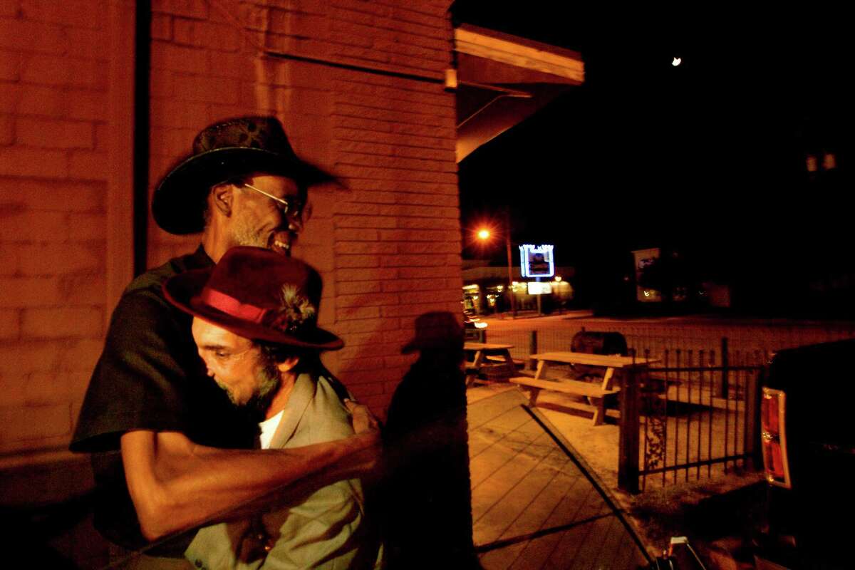 "I love this man," renowned blues drummer Jackie Gray said as he hugged Dr. Richard Patt into his shoulder outside The Big Easy Social and Pleasure Club where Patt was going to perform with a pickup band Friday, Aug. 10, 2012, in Houston.