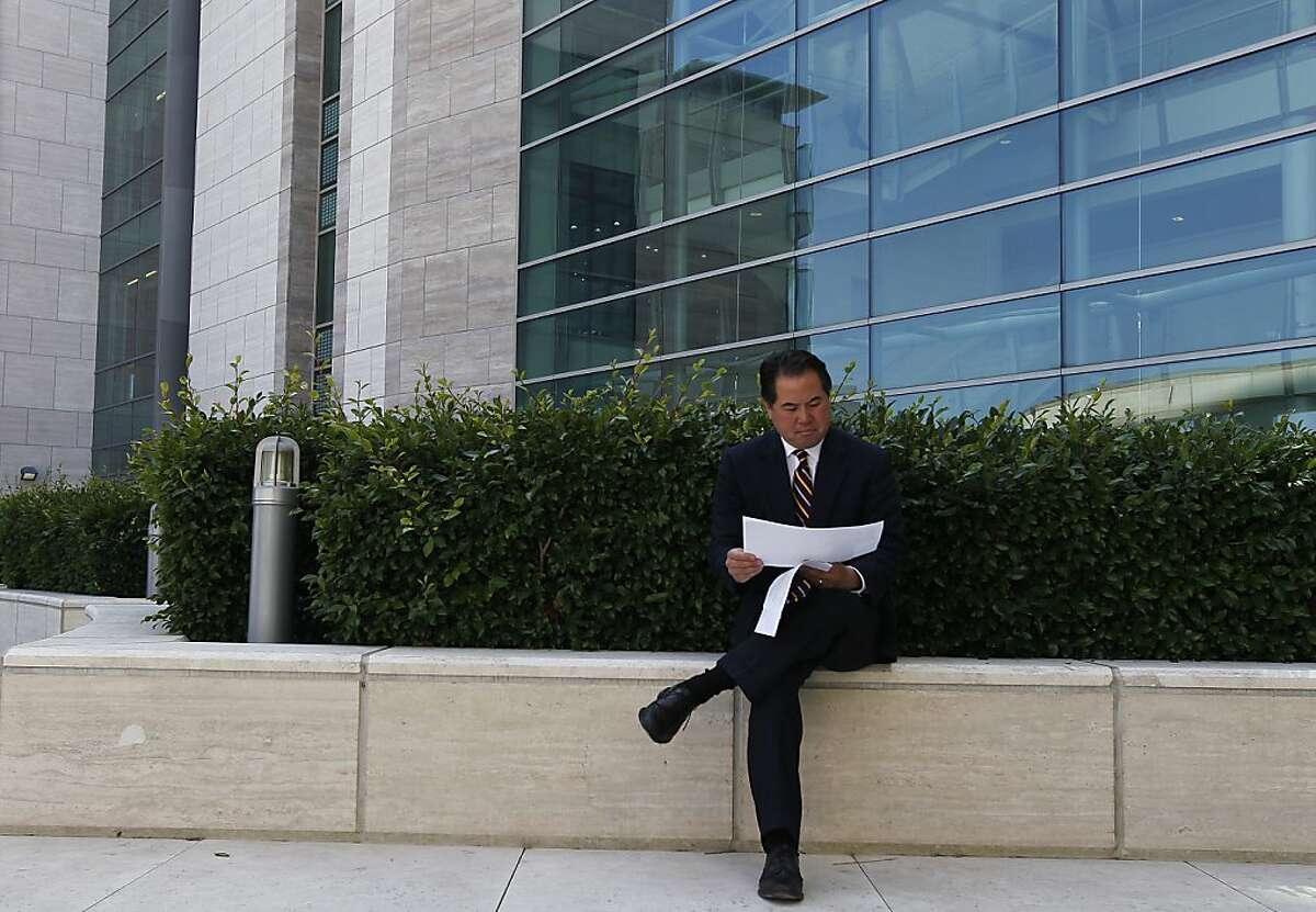 Assessor Phil Ting reviews notes in front of Genentech Hall at the UCSF Mission Bay campus in San Francisco, Calif. on Friday, Aug. 24, 2012. Ting released new data that shows the Mission Bay neighborhood has one of the city's fastest growing real estate values.