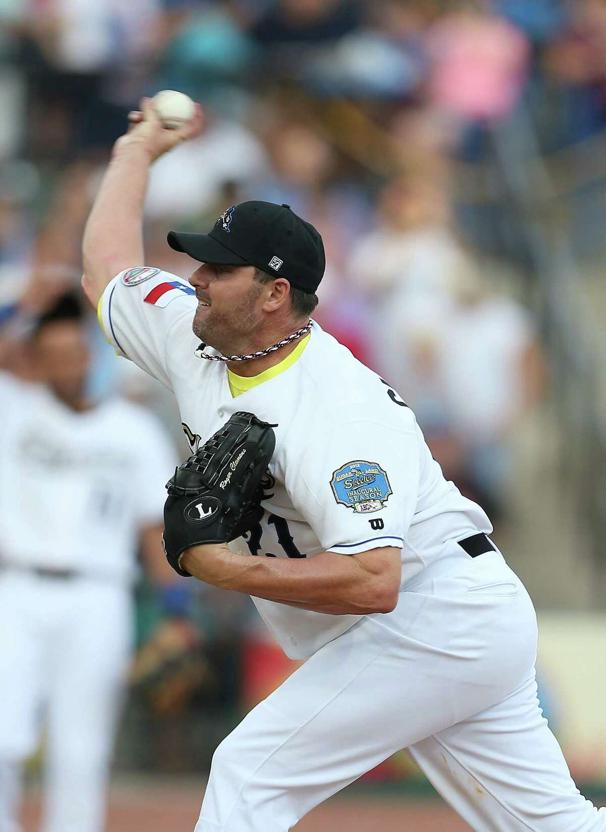 Roger Clemens gets back on the pitching mound, but says he's not