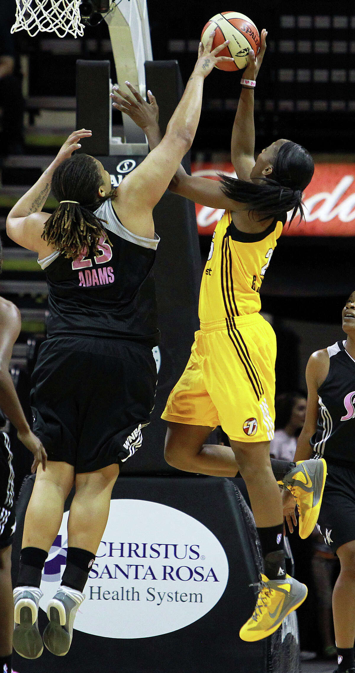 Danielle Adams gets a block on Glory Johnson as the Silver Stars host the Tulsa Shock at the AT&T Center on August 25, 2012.