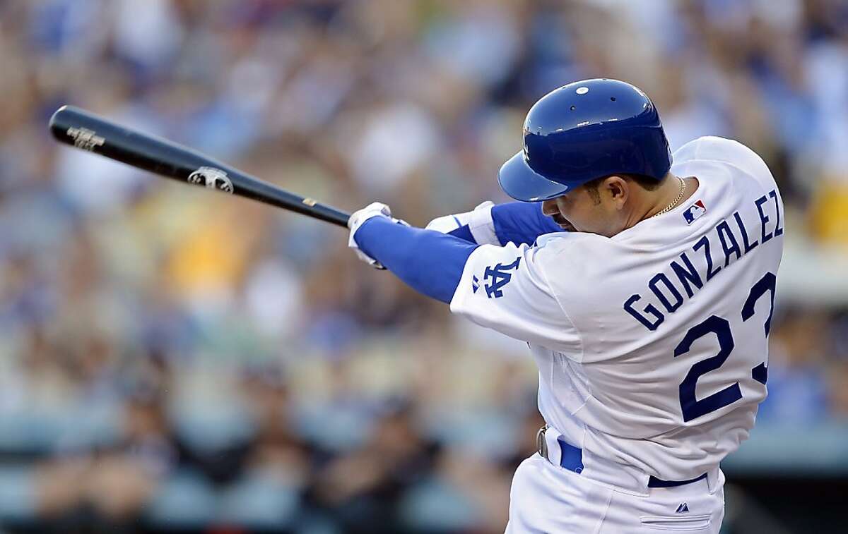 Los Angeles Dodgers' Adrian Gonzalez swings on a three-run home run during the first inning of a baseball game against the Miami Marlins, Saturday, Aug. 25, 2012, in Los Angeles. (AP Photo/Mark J. Terrill)