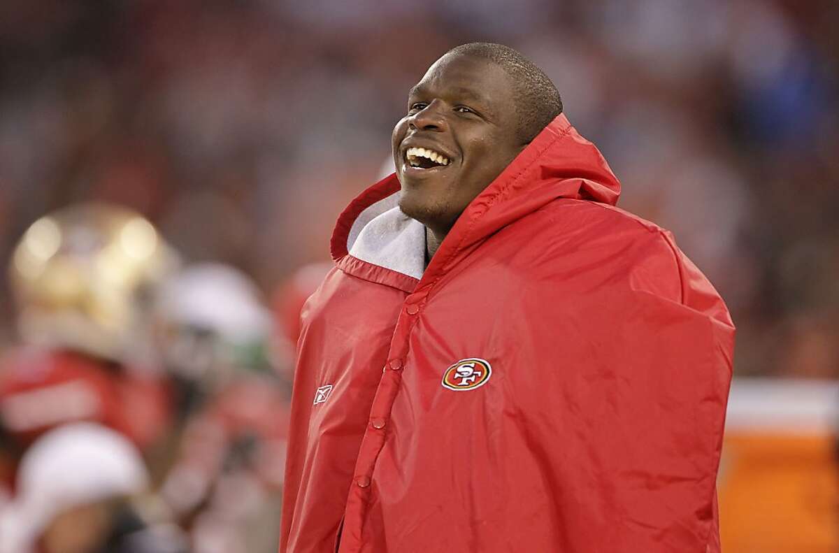 San Francisco 49ers running back Frank Gore laughs on the sideline during the second half of an NFL preseason football game against the Minnesota Vikings in San Francisco, Friday, Aug. 10, 2012. (AP Photo/Paul Sakuma)
