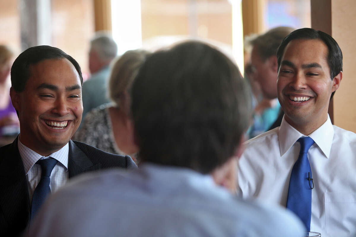 Mayor Julian Castro, right, and his brother, Congressional candidate Joaquin Castro, left, are interviewed by CBS News National Correspondent Lee Cowan as they tape a segment for the CBS Evening News at Rosario's in San Antonio on Friday, August 24, 2012. The segment will air the night Castro gives the keynote speech at the Democratic National Convention,