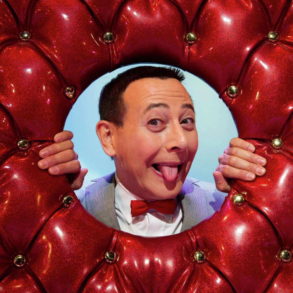 In this Friday, Oct. 29, 2010 photo, Paul Reubens, in character as Pee-wee Herman, poses on stage after a performance of "The Pee-wee Herman Show" on Broadway in New York. (AP Photo/Charles Sykes)