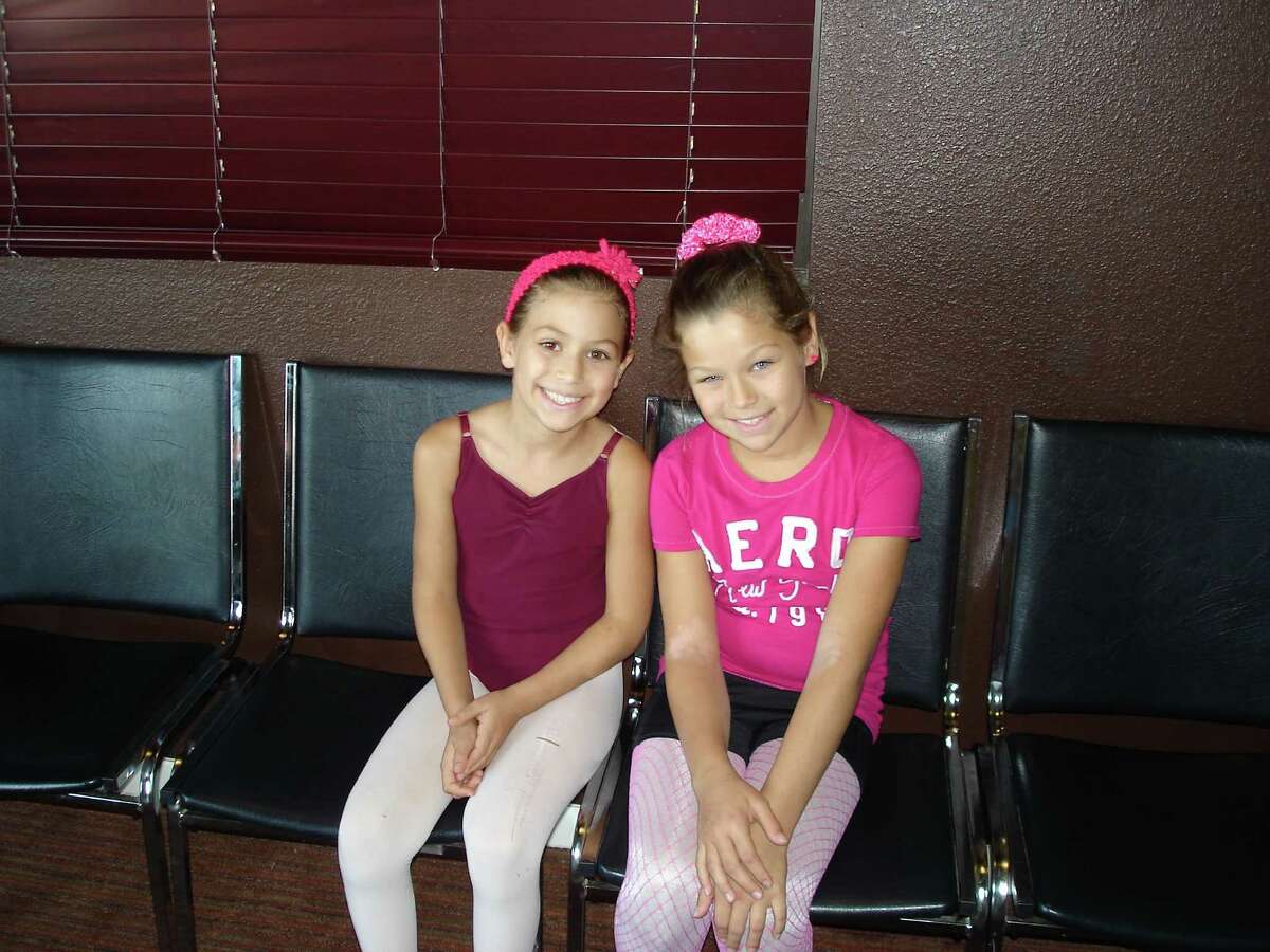 Reevie Bosnar, 9, convinced older sister (right) Taylor, 10, to join the American Dance Company?•s competitive troupe.
