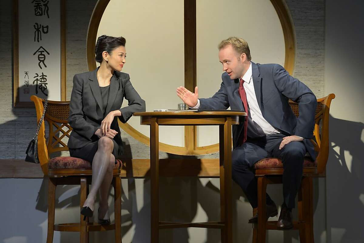 Xi Yuan (Michelle Krusiec), as deputy minister, meets privately with American businessman Daniel Cavanaugh (Alex Moggridge) to discuss his project in David Henry Hwang's "Chinglish" at Berkeley Repertroy Theatre
