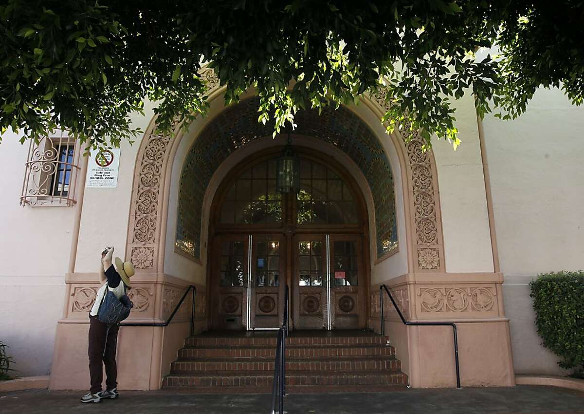 A passerby stops to photograph Sherman Elementary School on Wednesday August 29, 2012, in San Francisco Calif. A teacher at Sherman Elementary School on Union Street was dismissed today after it was discovered that she had a shady past.