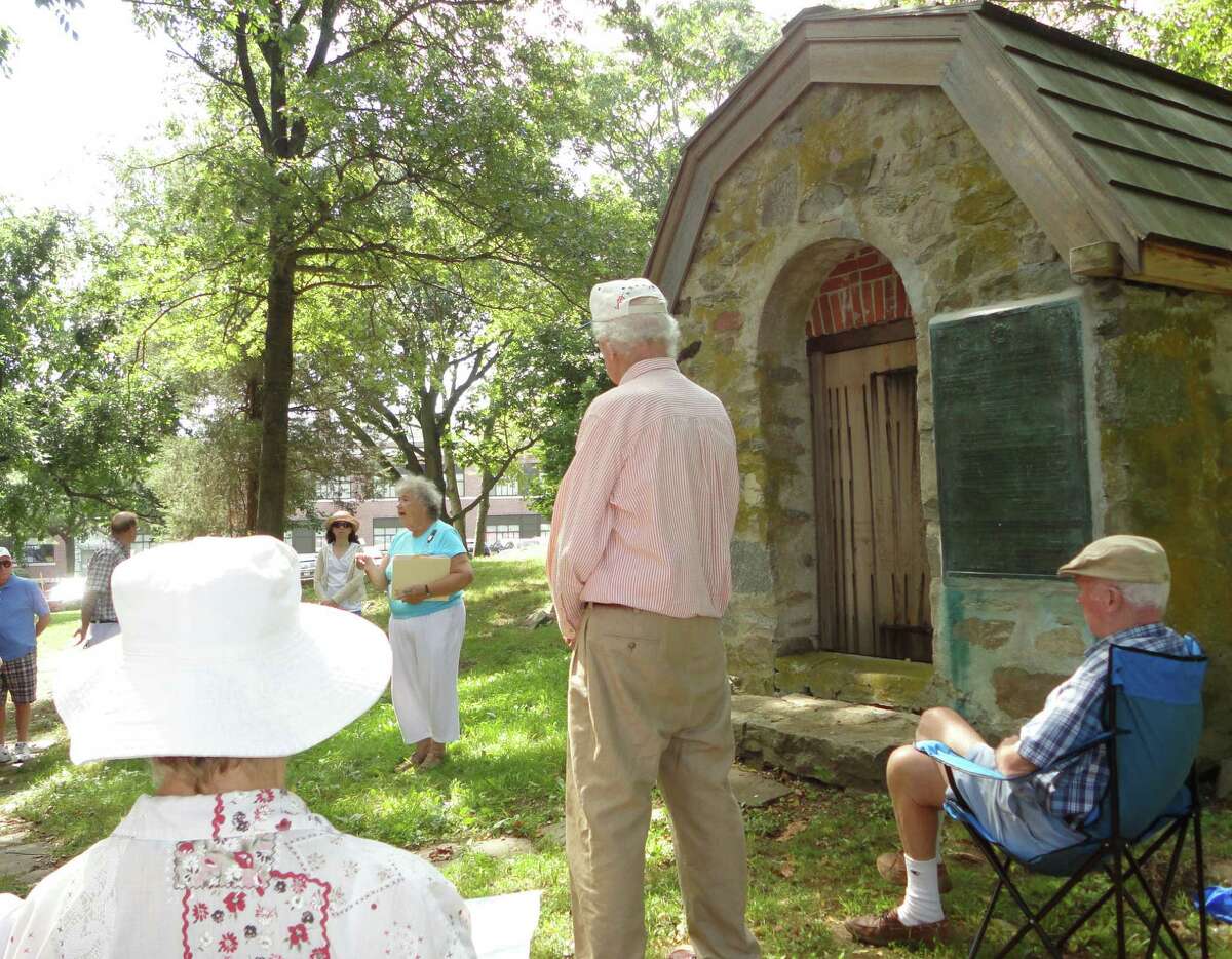 Betty Oderwald, president of the Connecticut State Society, U.S. Daughters of 1812, and a resident of Fairfield, shared information Sunday about the War of 1812 and Fairfield's role in it as she stood in front of a powder house from that era, which is behind Tomlinson Middle School. Oderwald said the Fairfield powder house is the only remaining example in Connecticut of powder houses that were used to store gunpowder and ammunition during early American history.