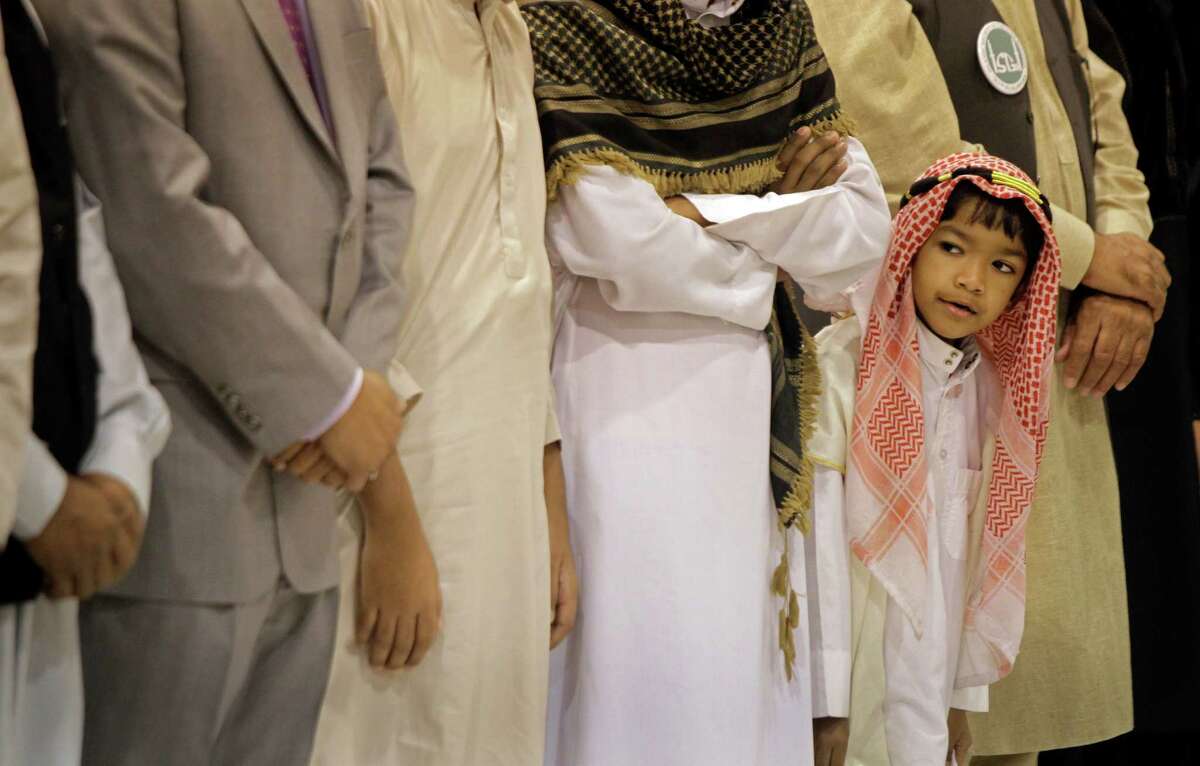 Zaafir Bin Anowar, 6, takes part in an Eid prayer event hosted by the Islamic Society of Greater Houston. A survey has found generational and political differences in how Americans view Muslims.