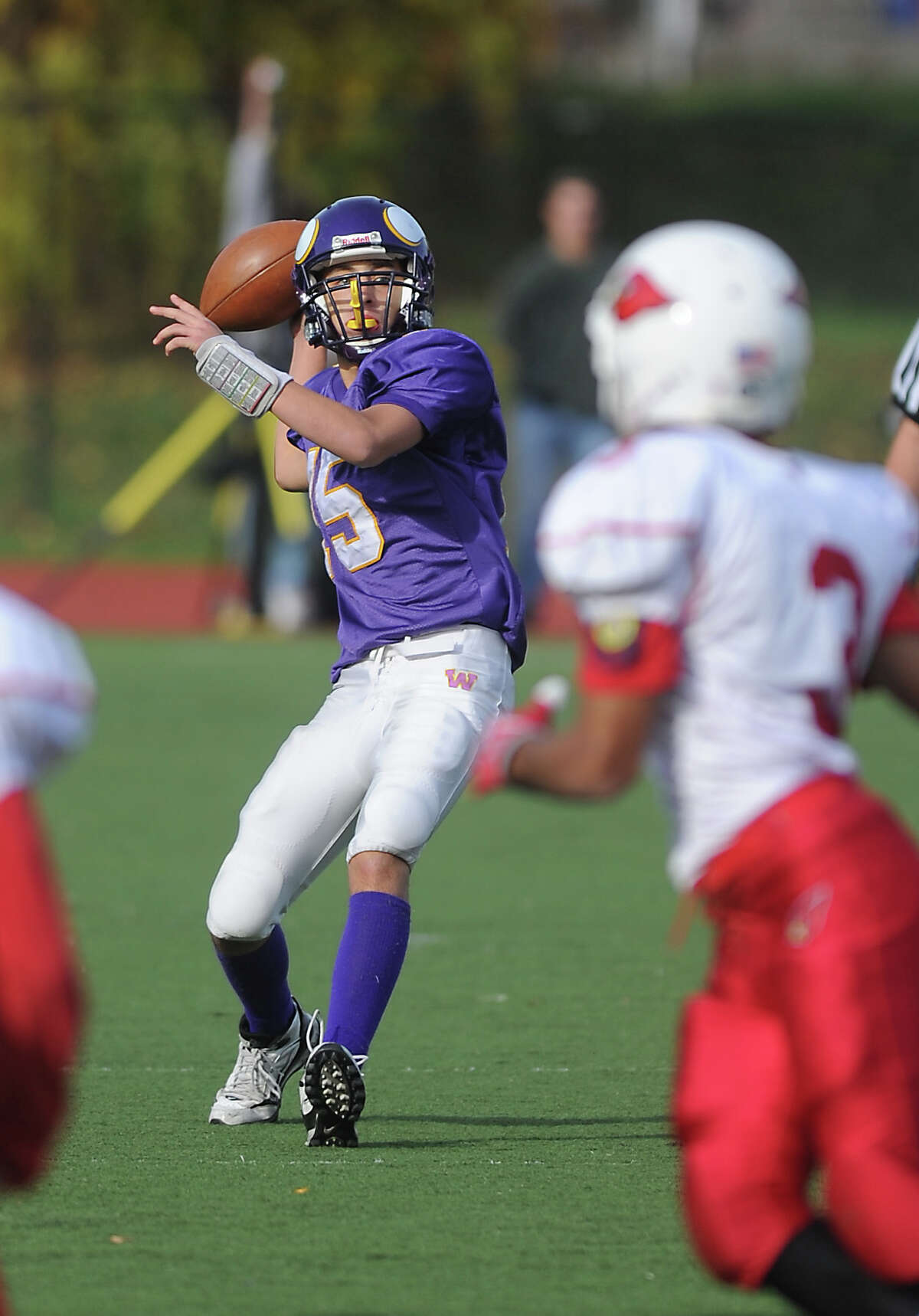 Westhill High School quarterback Peter Cernansky looks to throw against Greenwich High School in football action in Stamford, Conn. on Saturday October 30, 2010.
