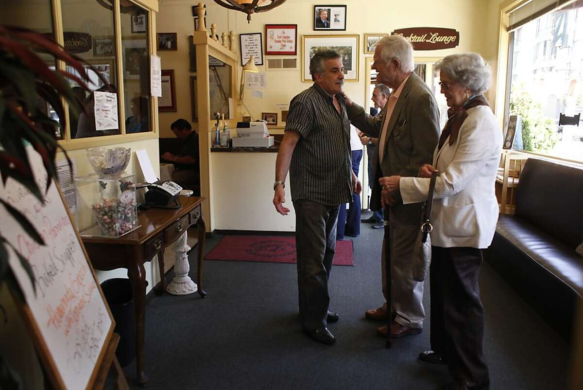 Co-owner Matteo Crirello (l to r) talks with Bob Logan and Diana Logan, both of San Mateo as the Logan's arrive to have a last meal at Caesar's Italian Restaurant before it's closure on Thursday, August 30, 2012 in San Francisco, Calif. Logan said he cried when he heard the news of Caesar's Italian Restaurant's closing.