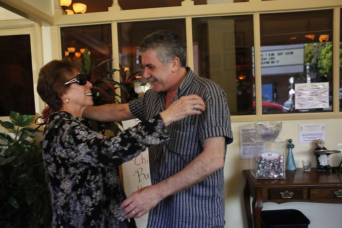 Grace Restivo (l to r) of San Jose and Matteo Crirello, co-owner Caesar's Italian Restaurant, greet each other with a hug as Restivo arrives with her family to have lunch at Caesar's Italian Restaurant on Thursday, August 30, 2012 in San Francisco, Calif.