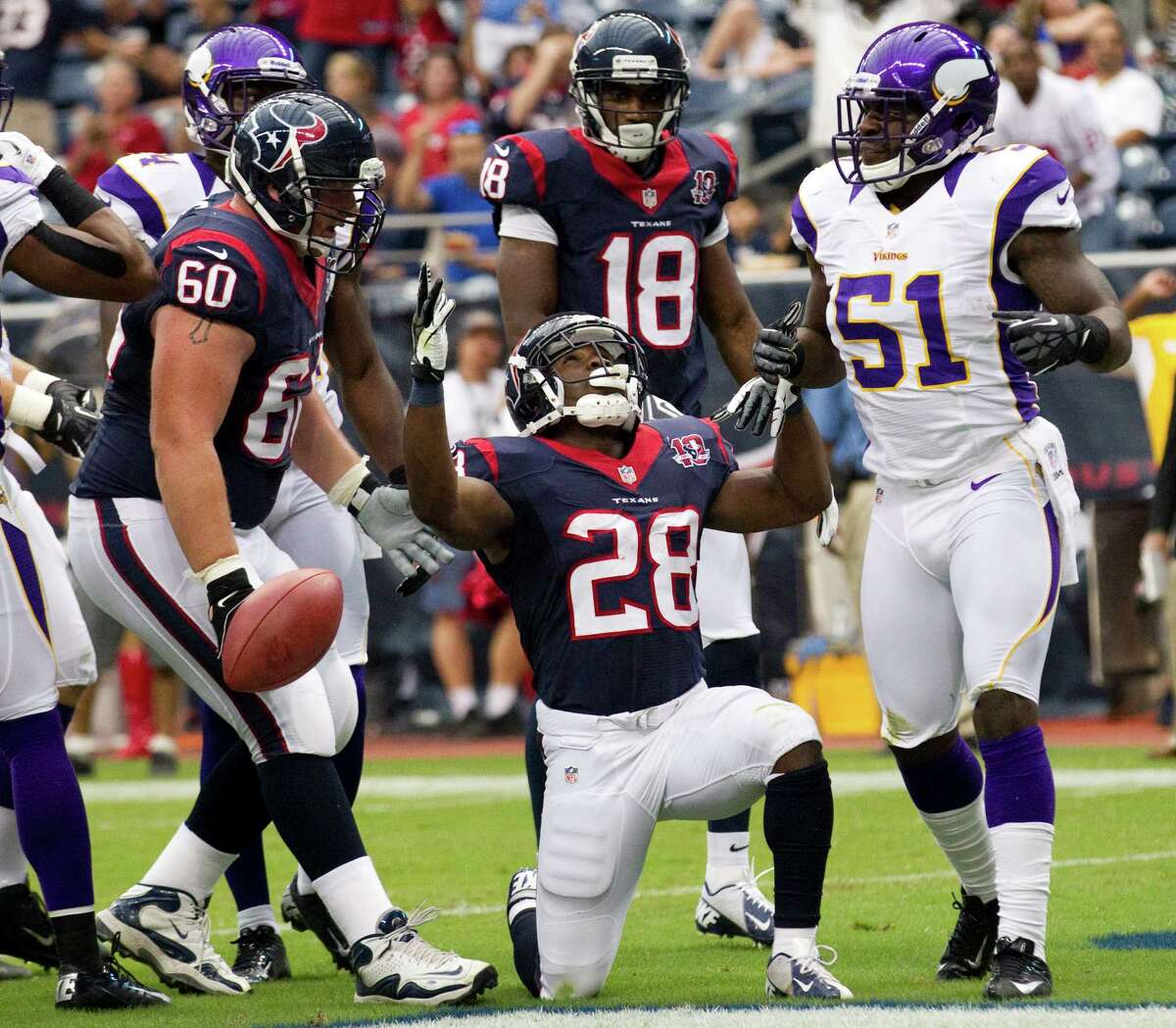 Texans running back Justin Forsett (28) celebrates his 3-yard touchdown run in the opening quarter against the Vikings. Forsett added a 5-yarder in the final quarter that was the difference in the win.