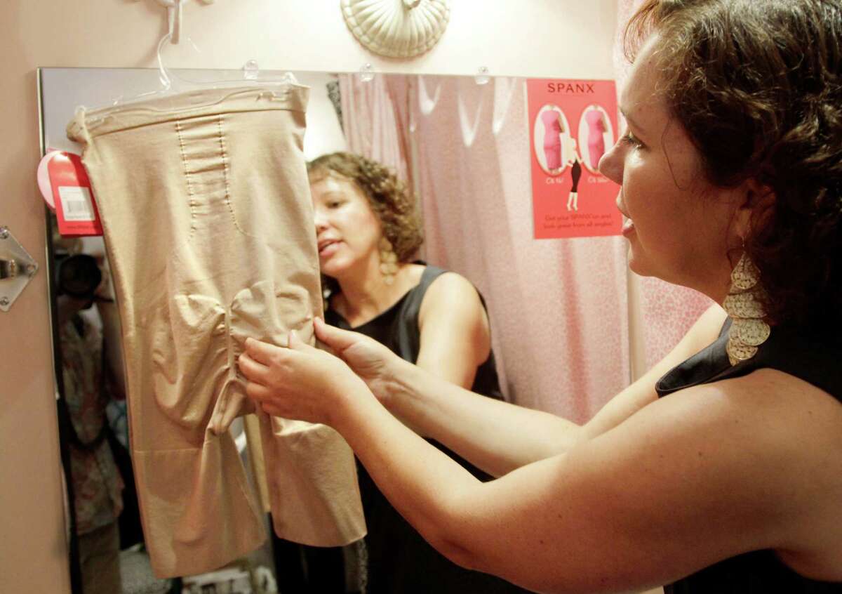 Donna Goetz, owner of the Hope Chest (lingerie boutique) in Haverford, Pennsylvania, displays a size medium, nude, Spanx shaping mid-thigh bodysuit, August 17, 2012. The backside of the body suit tightens and shapes that area. (Elizabeth Robertson/Philadelphia Inquirer/MCT)