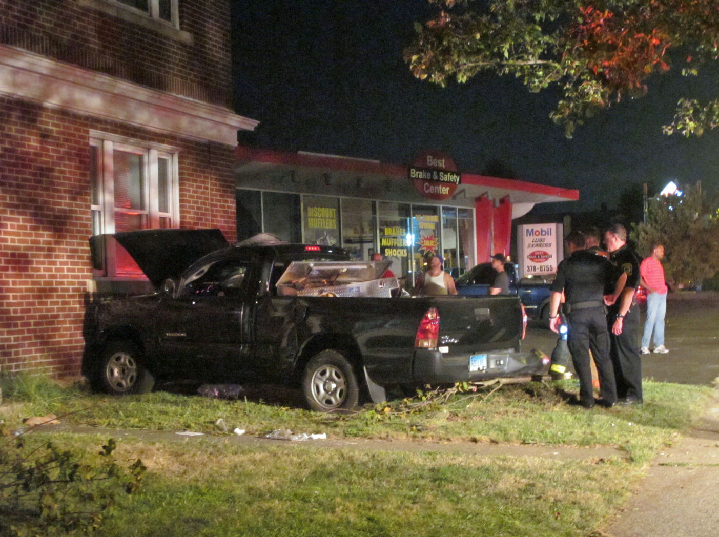 Man injured after pickup truck hits building