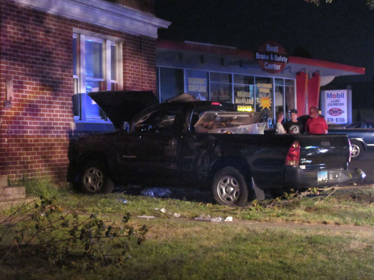 Man injured after pickup truck hits building