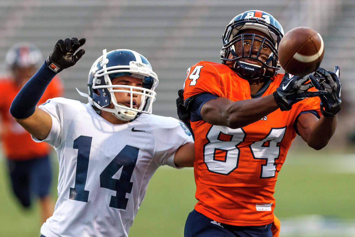 Brandeis wide receiver Larry Stephens tries to haul in a pass as Smithson Valley's Carlos Castello closes in during the first half of the season opener for both teams at Farris Stadium on Aug. 31, 2012. Smithson Valley won the game 41-7. MARVIN PFEIFFER/ mpfeiffer@express-news.net
