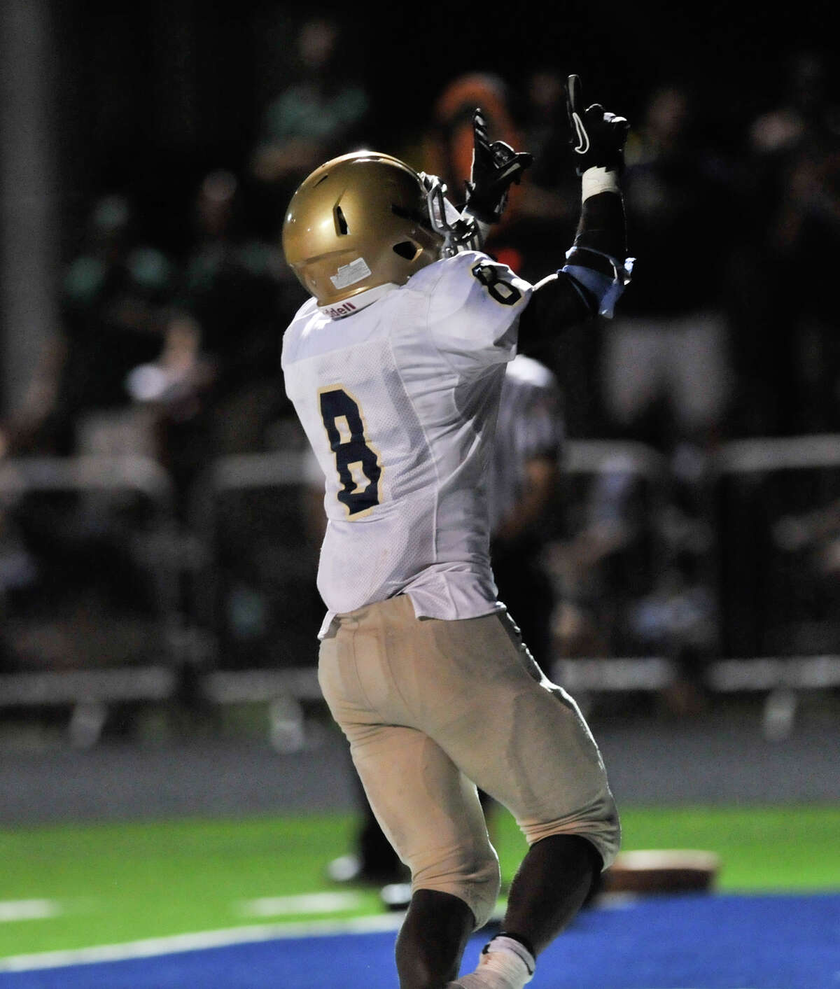 Kyron Davis of Holy Cross points to the sky after scoring a first half touchdown versus Central Catholic.