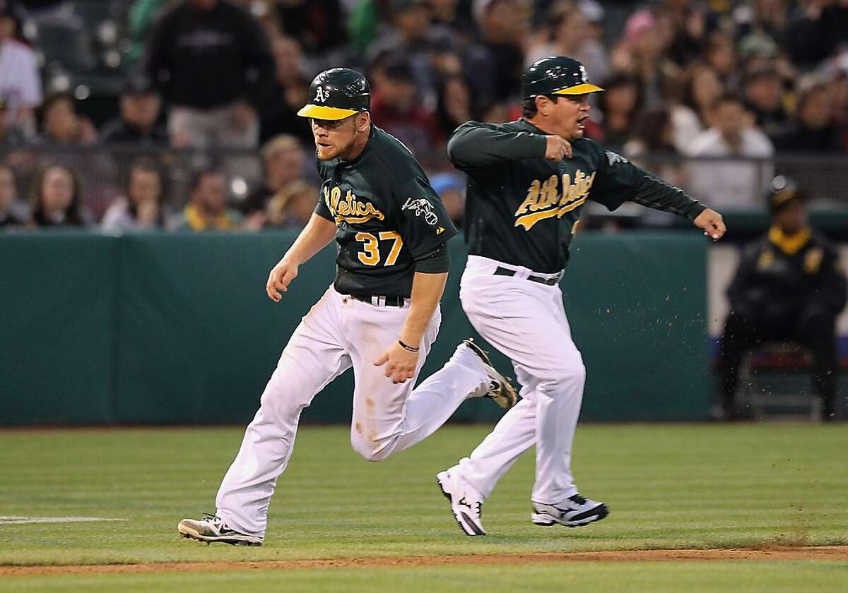 A's pound on Red Sox, pennant race door