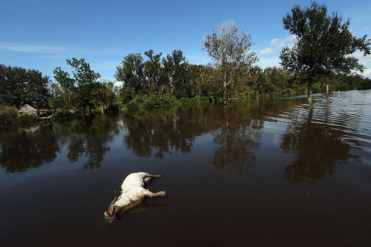 Flooding, blackouts linger after Isaac