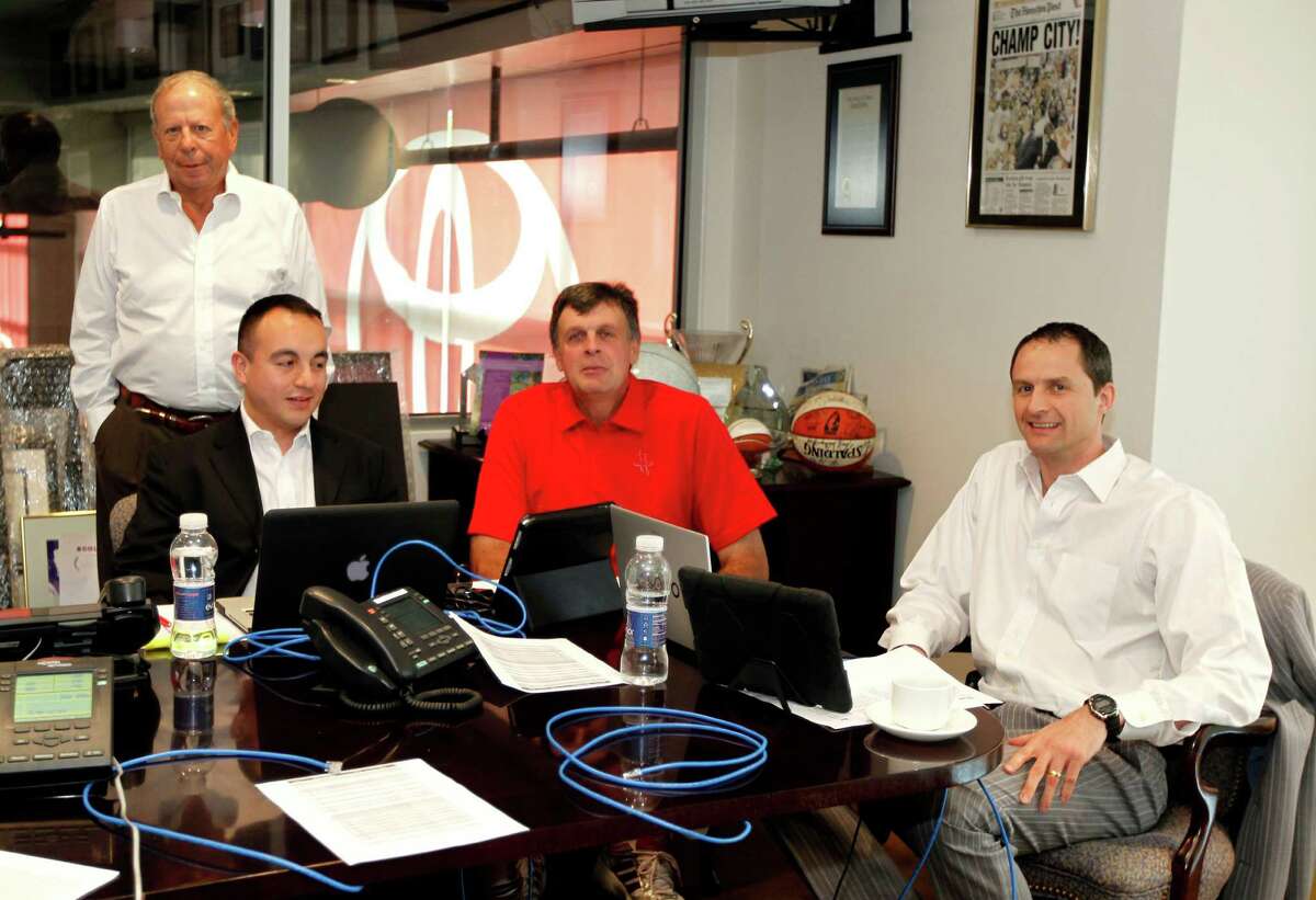 The Houston Rockets Owner Leslie Alexander left, Vice President of Player Personnel Gersson Rosas, Head Coach Kevin McHale and Director of Global Scouting Arturas Karnisovas work during the 2012 NBA Draft as the Rockets host a NBA draft party at Toyota Center Thursday, June 28, 2012, in Houston. ( James Nielsen / Chronicle )