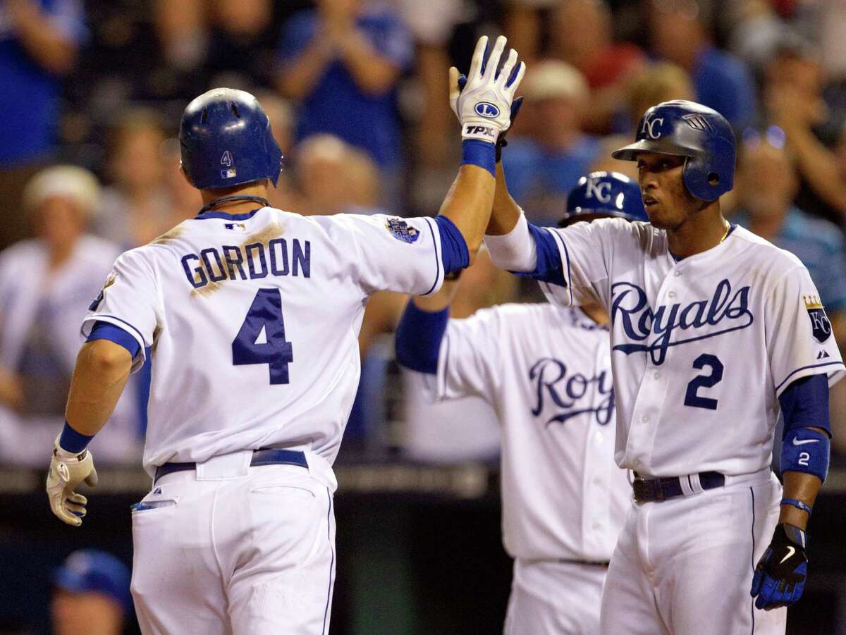Kansas City’s Alex Gordon is congratulated by Alcides Escobar following his two-run home run off the Rangers’ Matt Harrison during the fifth inning of the Royals’ win at Kauffman Stadium.