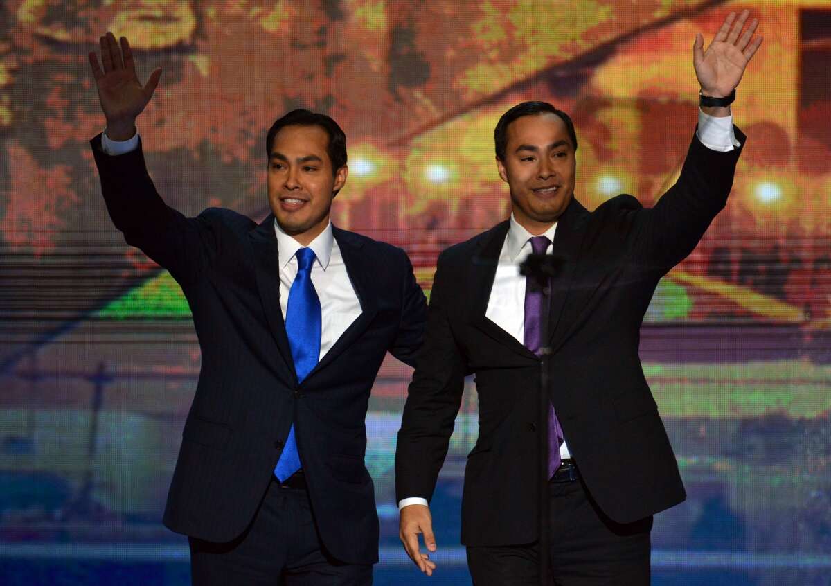 San Antonio Mayor Julian Castro (L) and his brother Joaquin Castro wave to the audience  at the Time Warner Cable Arena in Charlotte, North Carolina, on September 4, 2012 on the first day of the Democratic National Convention (DNC). The DNC is expected to nominate US President Barack Obama to run for a second term as president.