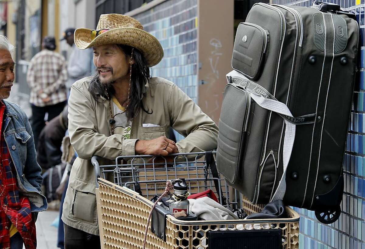 David, a homeless person, waits in a line to eat at Glide Memorial Church in San Francisco in this 2012 file photo.