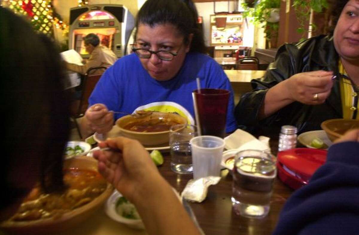Here's a rundown of where to find menudo, normally reserved for weekends and holidays, every day in San Antonio.Yolanda Torres enjoys a bowl of menudo at The Malt House on Jan. 1, 2001. (Jerry Lara / San Antonio Express-News)