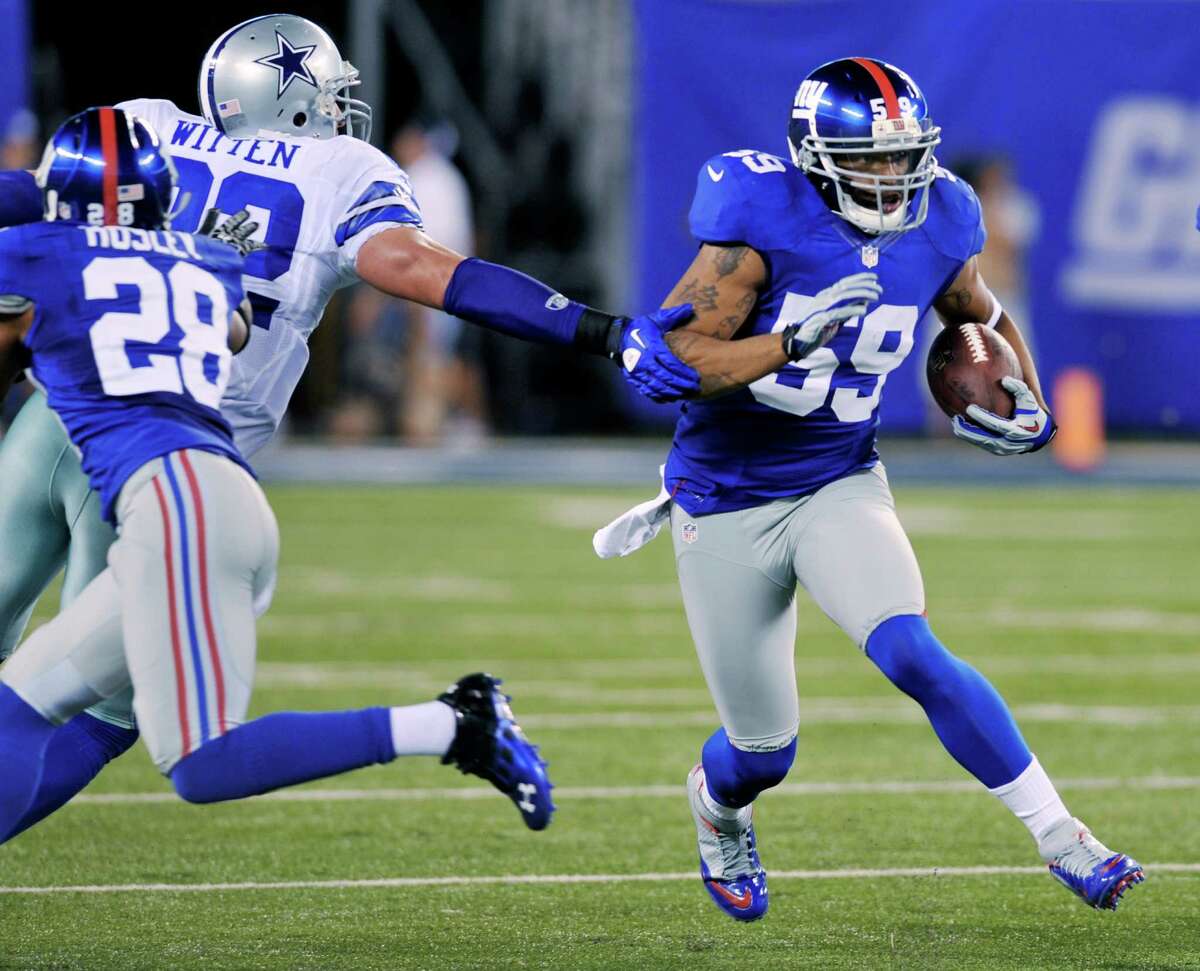 New York Giants linebacker Michael Boley was stopped just short of the end zone after picking off Tony Romo.