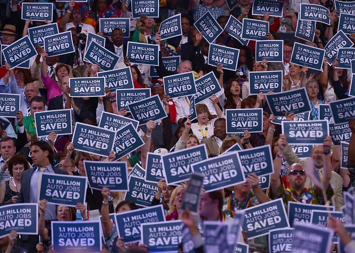 Placards are held up at the 2012 Democratic National Convention at Time Warner Cable Arena, Wednesday, September 5, 2012 in Charlotte, North Carolina. (Olivier Douliery/Abaca Press/MCT)