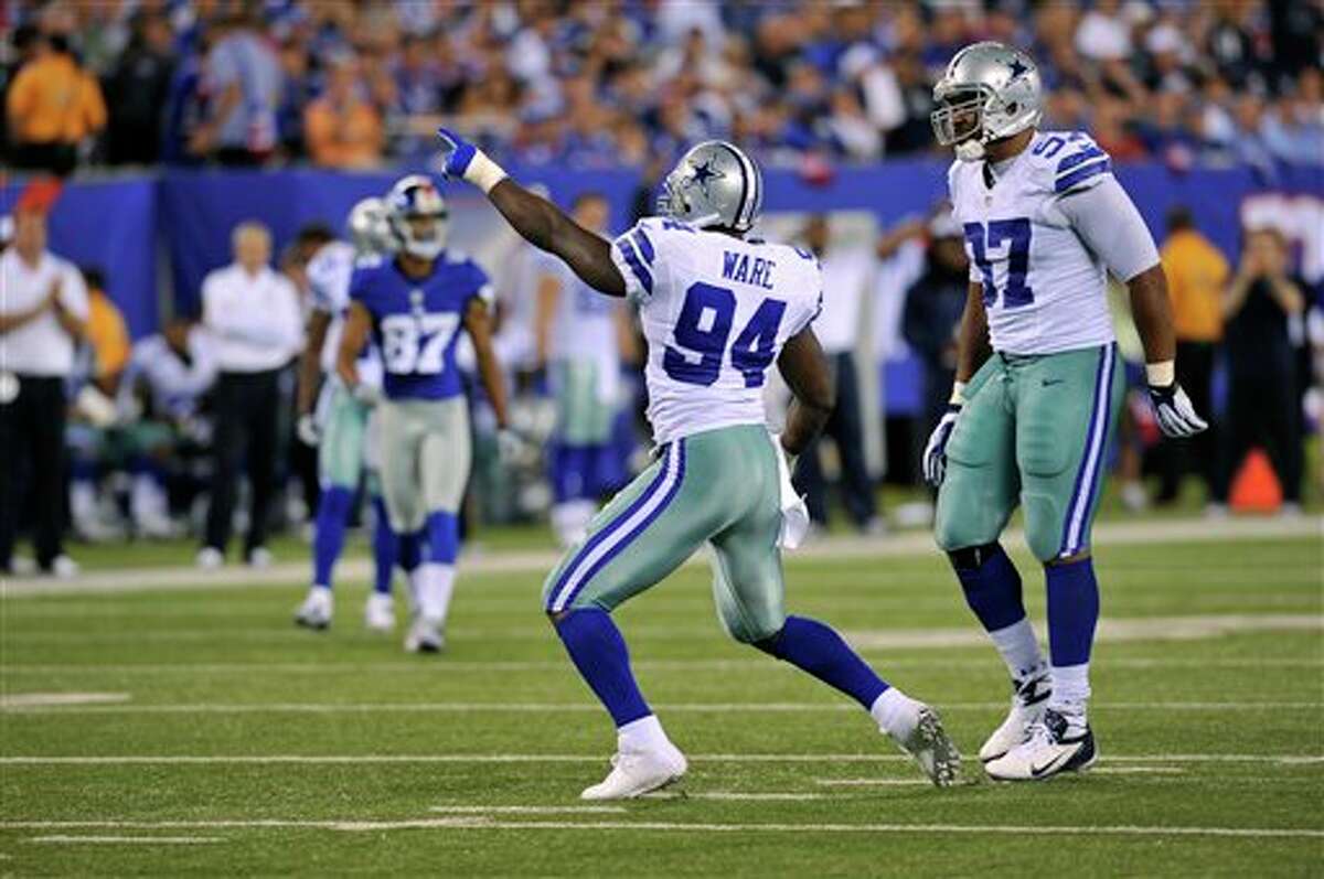 Dallas Cowboys' DeMarcus Ware celebrates his sack during the first half of an NFL football game against the New York Giants Wednesday, Sept. 5, 2012, in East Rutherford, N.J. (AP Photo/Bill Kostroun)