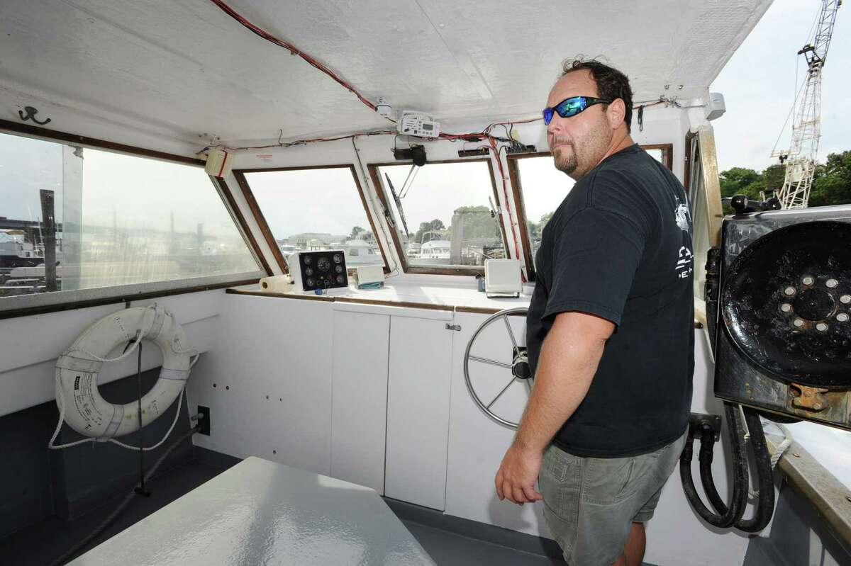Lobsterman Gus Bertolf Jr. of Cos Cob captains his 30-foot boat, Island Girl, in Cos Cob Harbor, Thursday, Sept. 6, 2012. Lobster catches have gone down in Long Island Sound and Bertolf blames pollution for the decline in population.