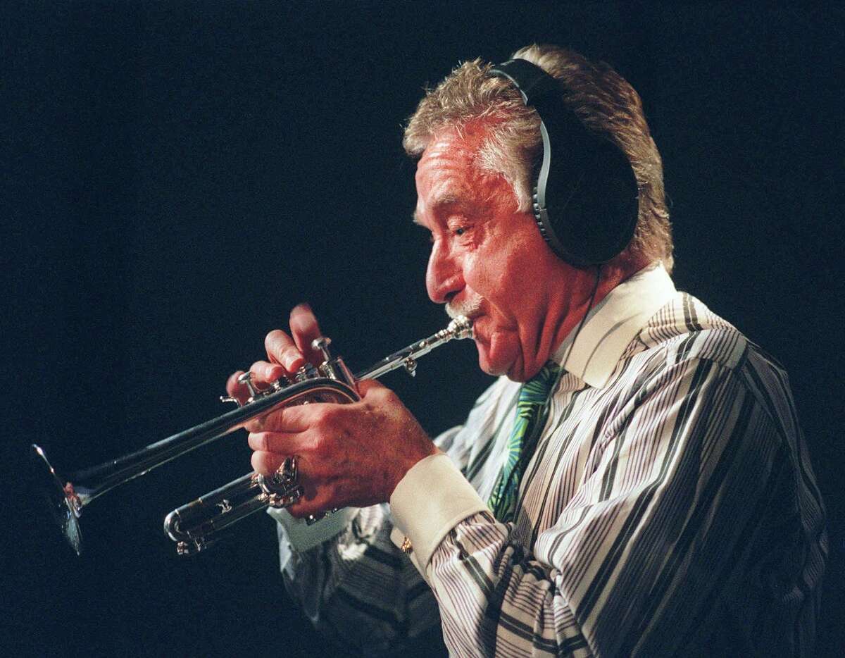 FILE--Doc Severinsen is shown in New York in this June 9, 1998, file photo. During 25 years on 'The Tonight Show,' Severinsen was known as much for his colorful and clashing outfits as for his musical talent. But for his current tour with his big band, he purchased a few traditional suits and quickly found out he wasn't suited for the conventional duds. (AP Photo/Colby Katz, File)