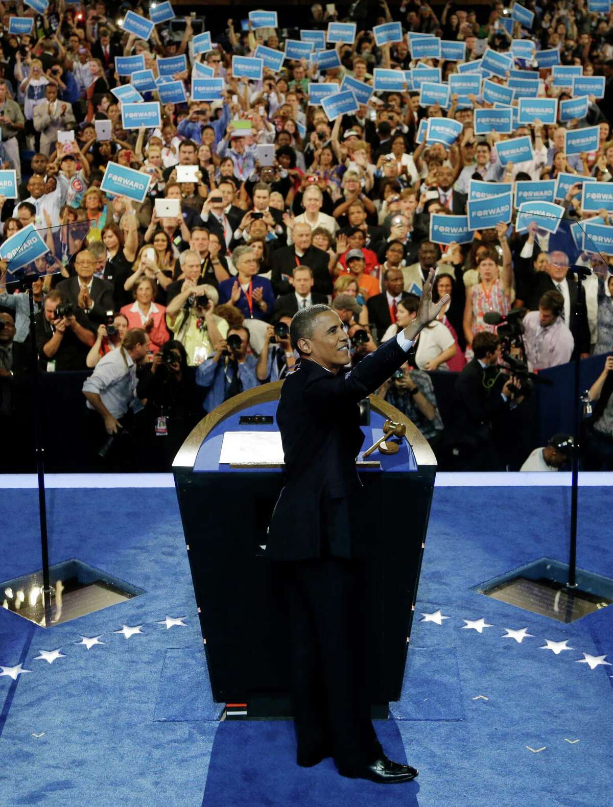 President Barack Obama waves to delegates at the Democratic National Convention in Charlotte, N.C., on Thursday, Sept. 6, 2012. (AP Photo/Charlie Neibergall)
