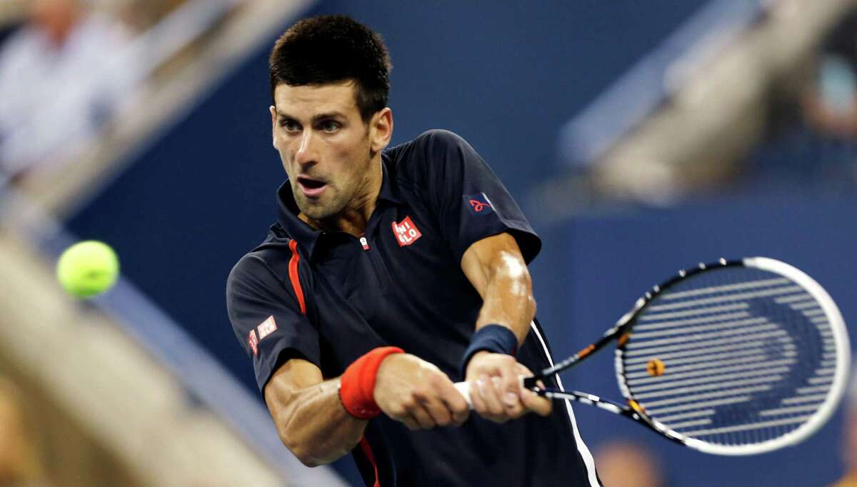 Novak Djokovic, of Serbia, returns to Juan Martin del Potro, of Argentina, in the quarterfinal round of play at the U.S. Open tennis tournament, Thursday, Sept. 6, 2012, in New York. (AP Photo/Charles Krupa)