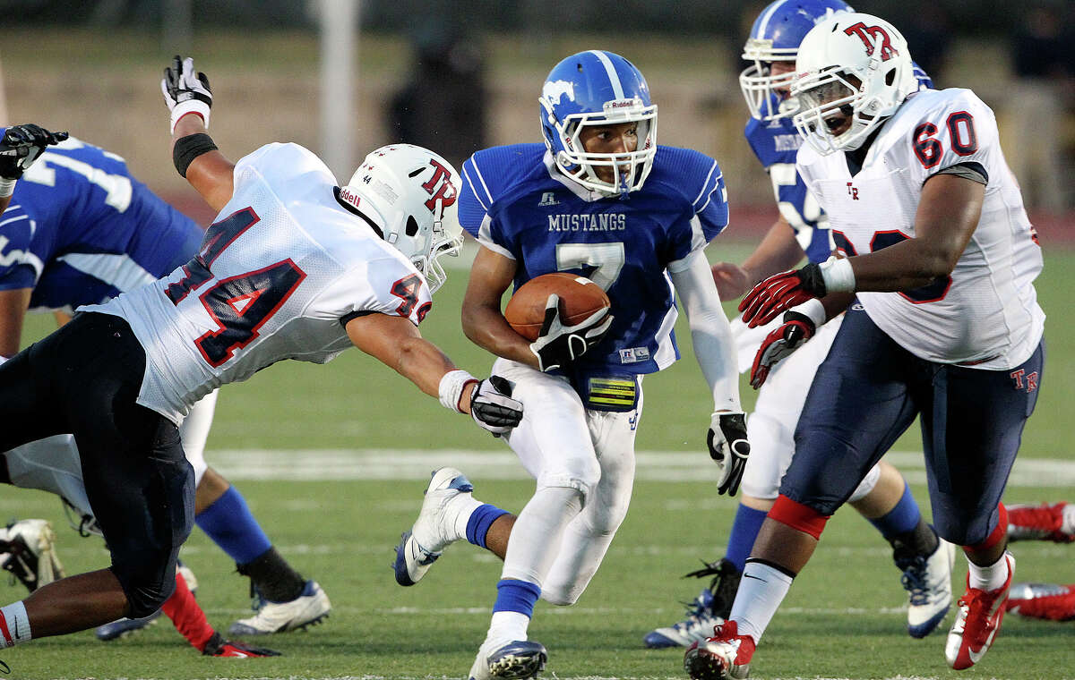 Mustang running back Dae Ross cuts through the middle as Jay plays Roosevelt at Gustafson Stadium on September 6, 2012.