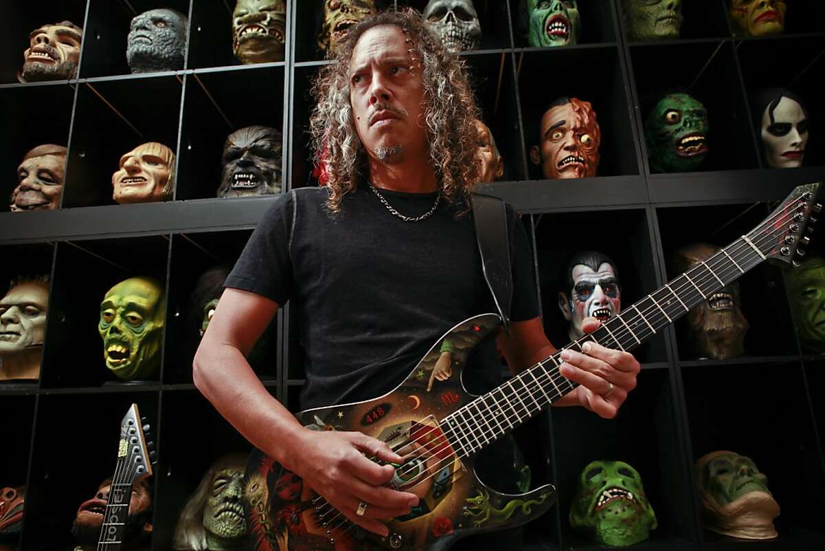 Kirk Lee Hammett, guitarist for Metallica and longtime horror film fanatic, is coming out with a book, "Too Much Horror Business - The Kirk Hammett Collection." Hammett is seen with part of his horror film collection in his San Francisco, Calif., home on Thursday, Aug. 23, 2012.